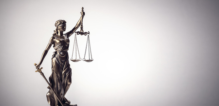 Scales of Justice on gray background
