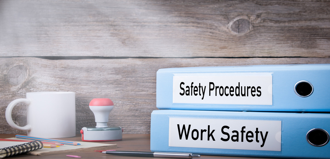 Work Safety and Safety Procedures binders on table
