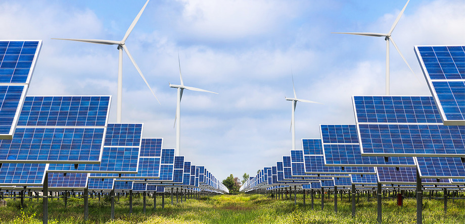 Solar Panels and Windmills in field