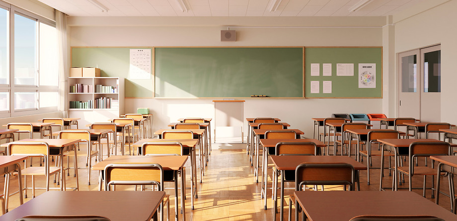 school classroom with empty desks and chairs facing the board