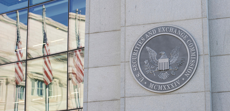 SEC logo on their building with flags in reflection