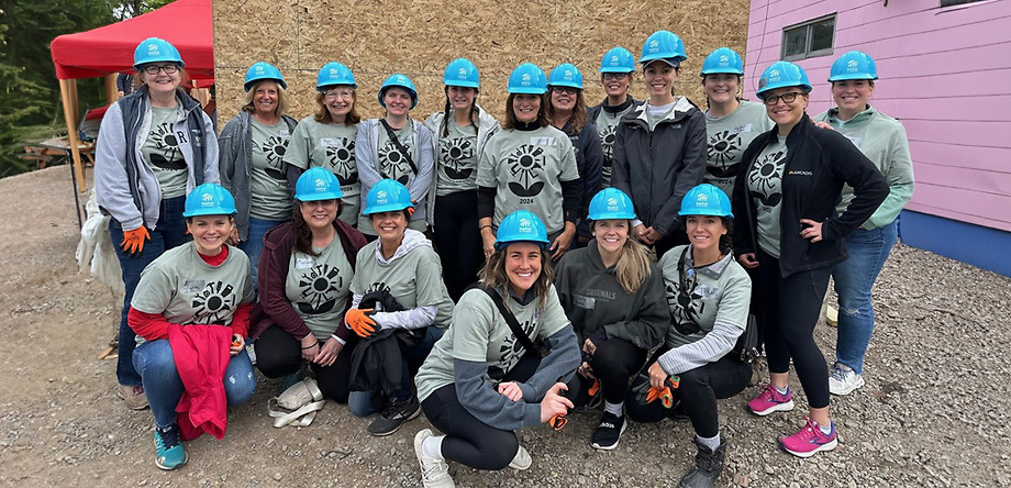 Women of Hodgson Russ and other companies with hard hats at work site